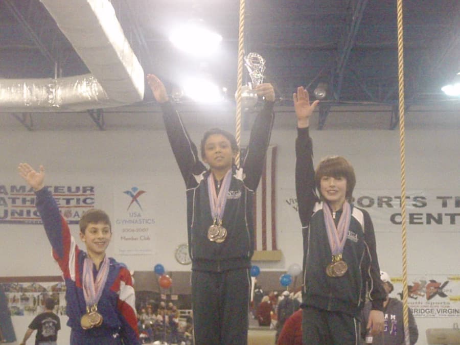 Me as a young gymnast on the awards podium